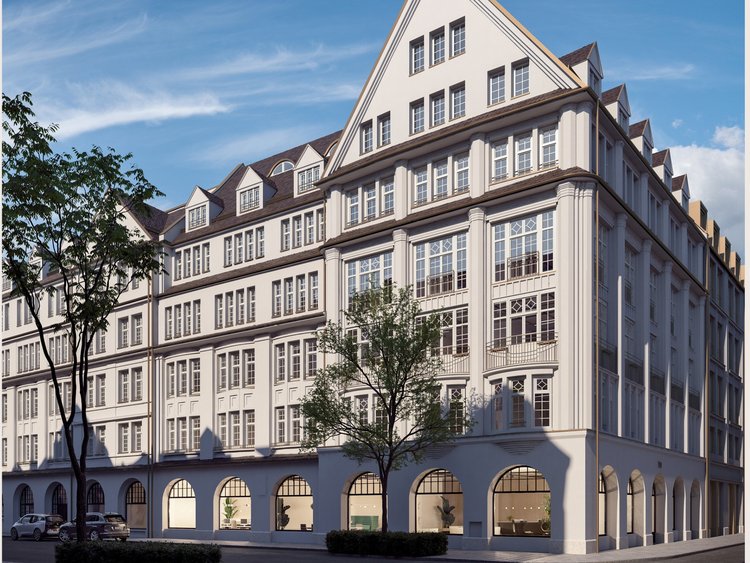 View of the facade of an old, stylishly renovated building in a city center.