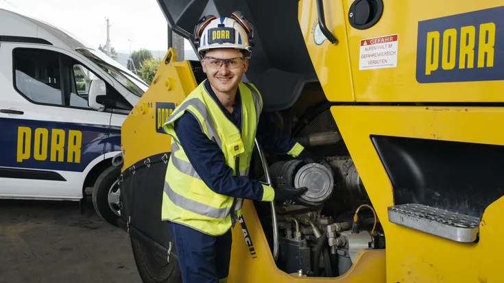Picture of the PES. It shows a construction worker next to a large machine