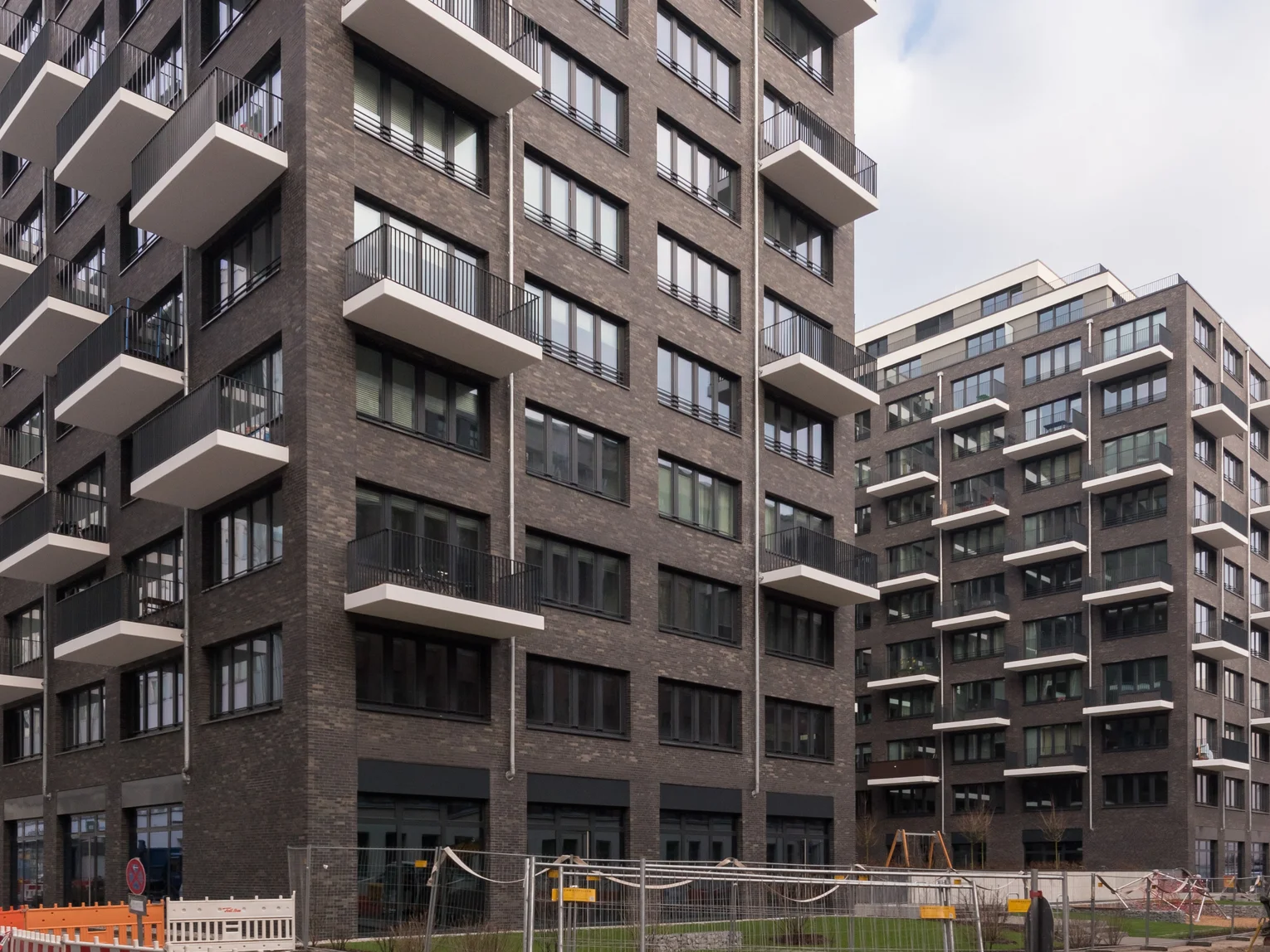 Alexanderplatz residential neighbourhood, Berlin Photo: Residential neighbourhood Alexanderplatz Berlin: perspective view of several parts of the building with dark façade and white balconies
