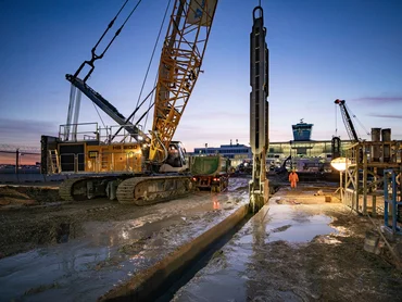 Picture shows a diaphragm wall grab at work at night.