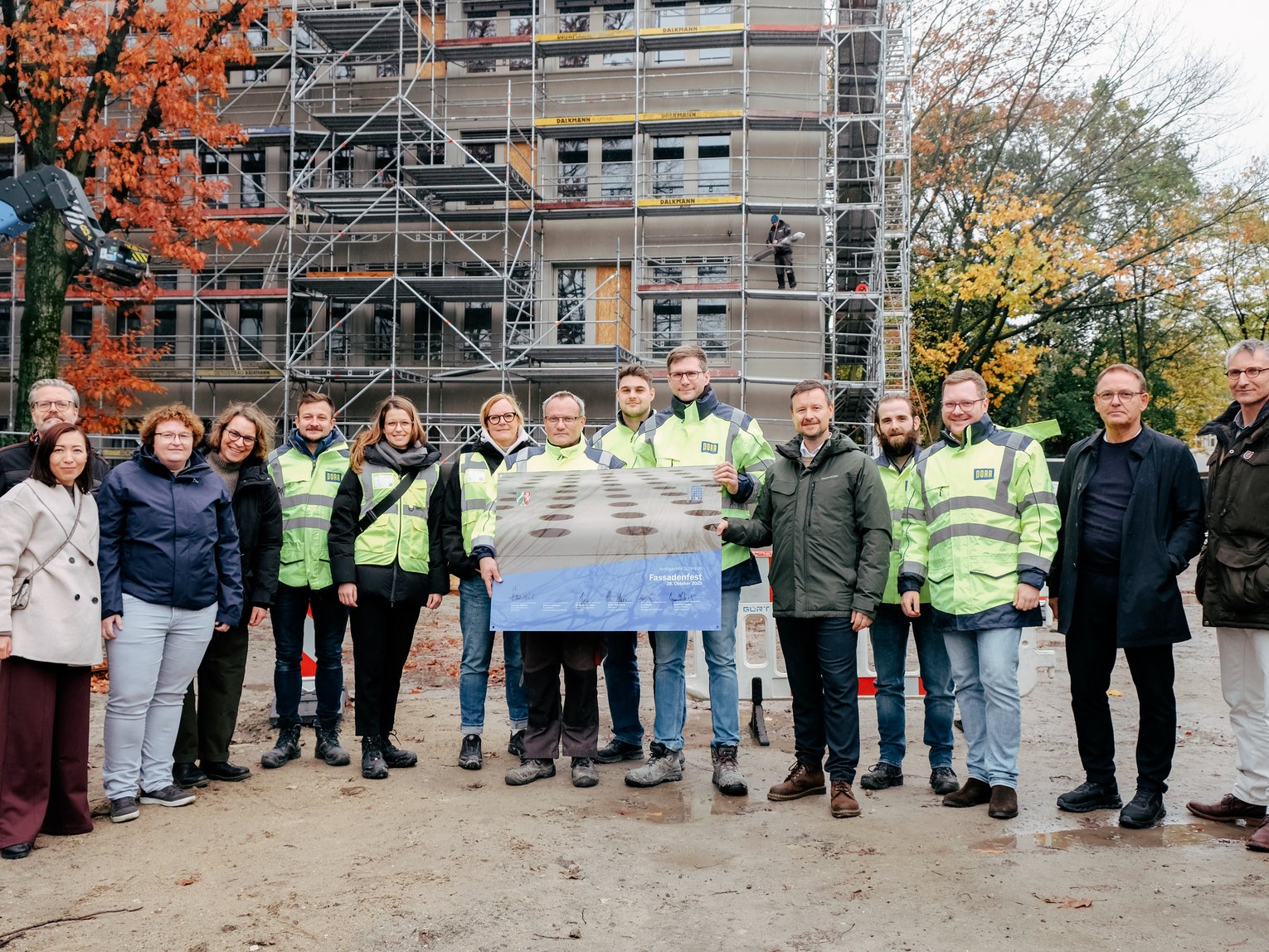 Group photo. Many people in construction clothing.