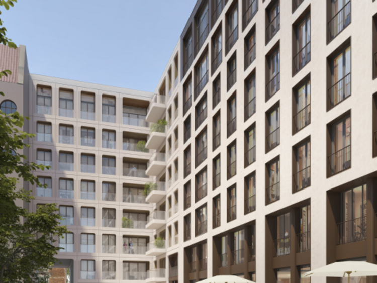 View of a green inner courtyard of a building.